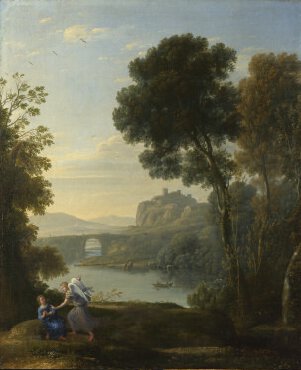 Two figures in front of a wooded lake.
